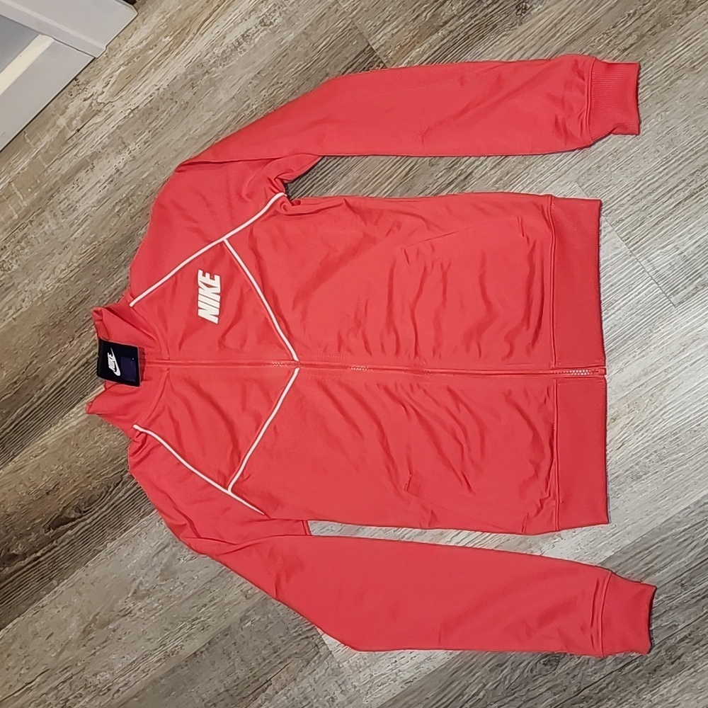 Nike full zip top color coral and white size small bust 17in. Length 23 1/2 inch
